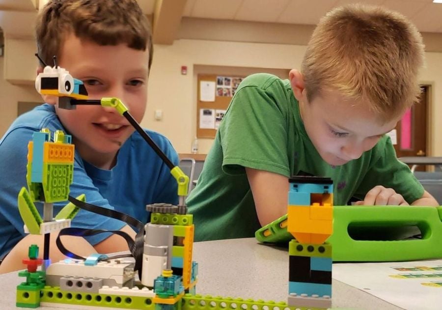 Two boys working on robotics