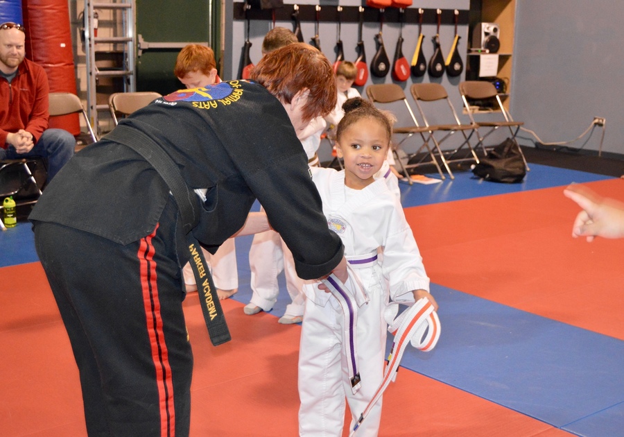 child getting new belt degree at Kicks R Us PAMA summer camp