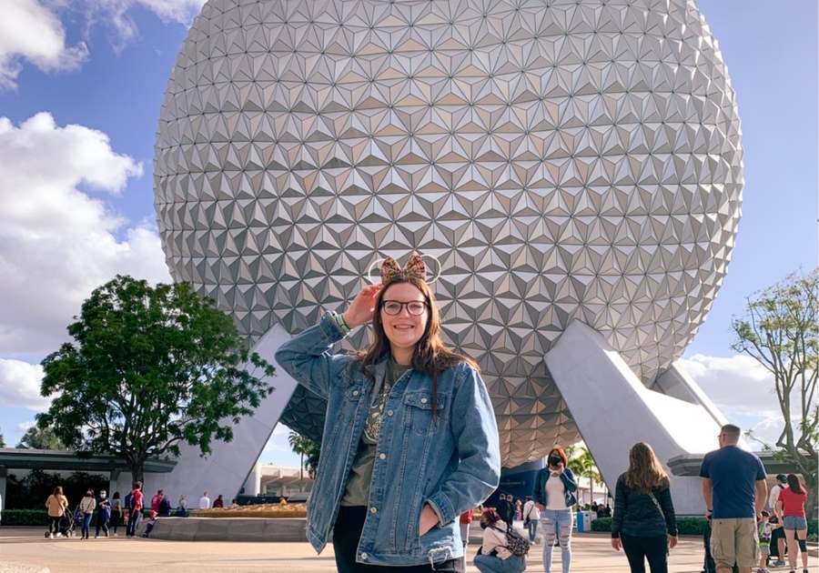 Woman in front of Globe at Epcot