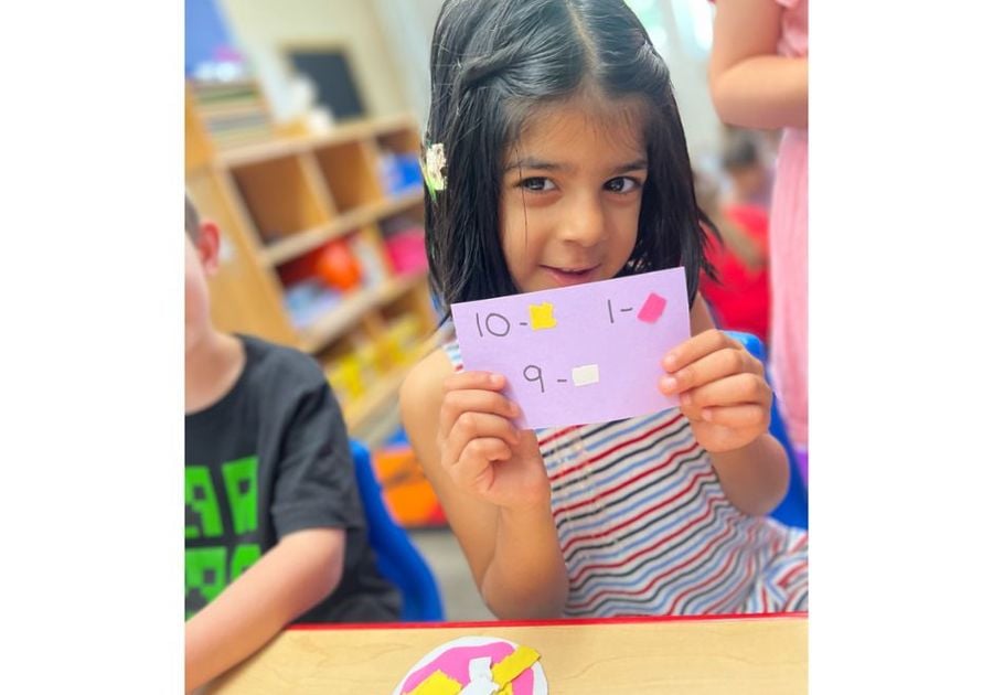 little girl showing her work