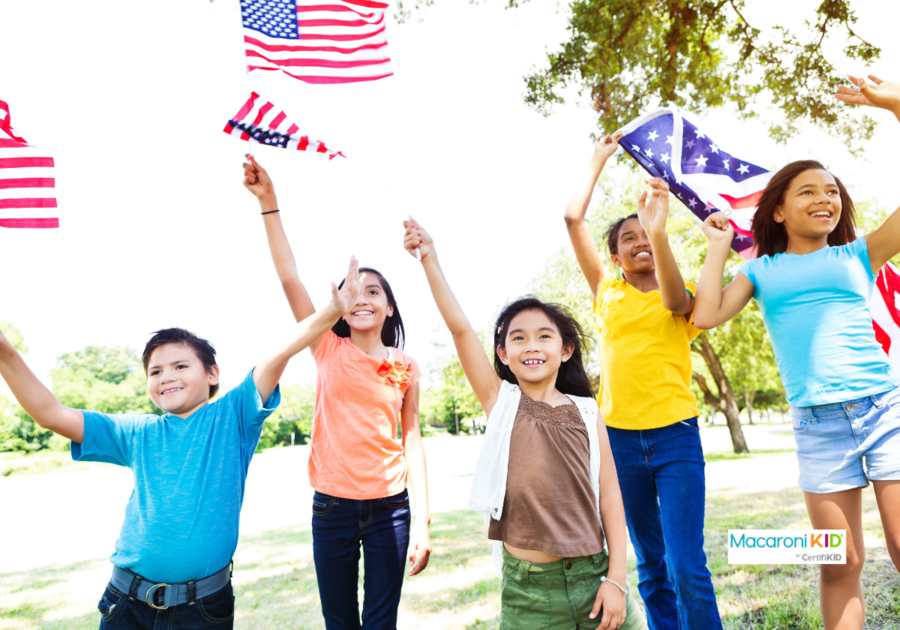 kids wave American flags