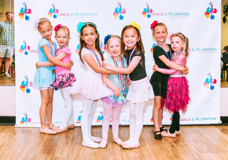 smiling children posing for pictures after a Dance Exploration class