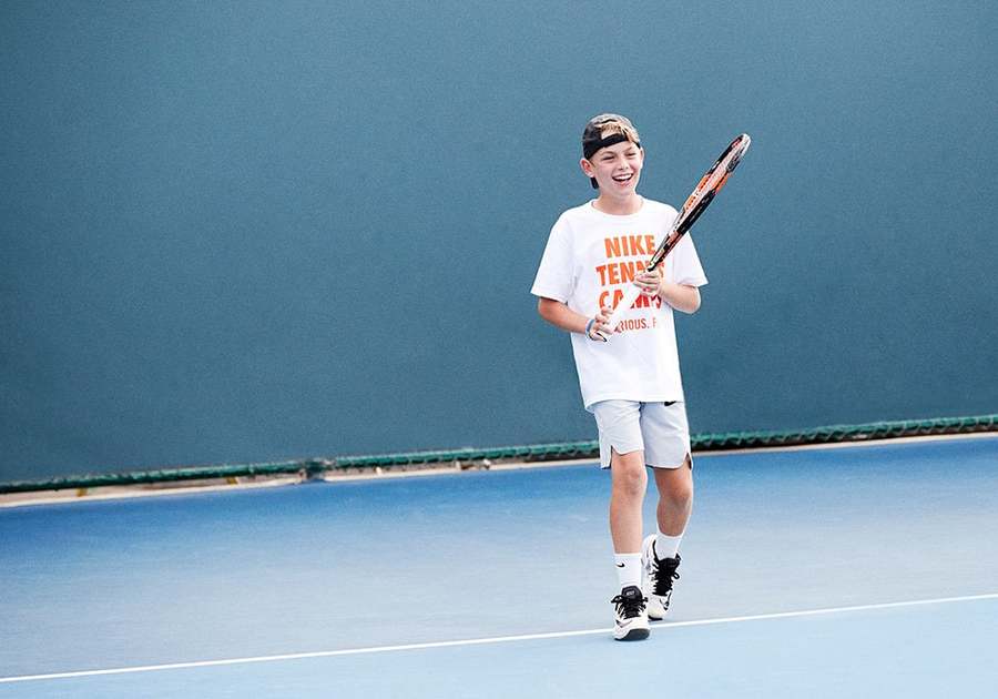 Boy playing tennis