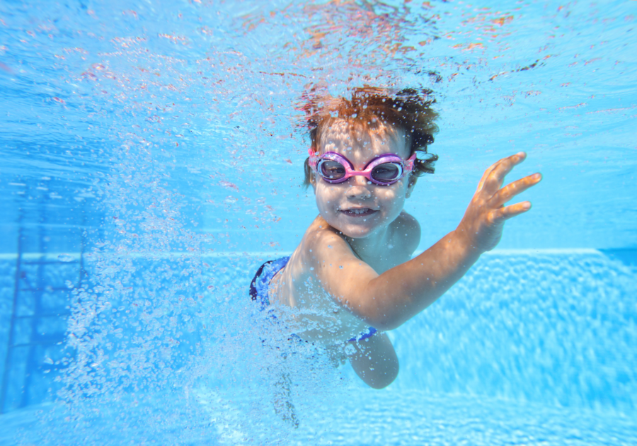 kid with goggles underwater