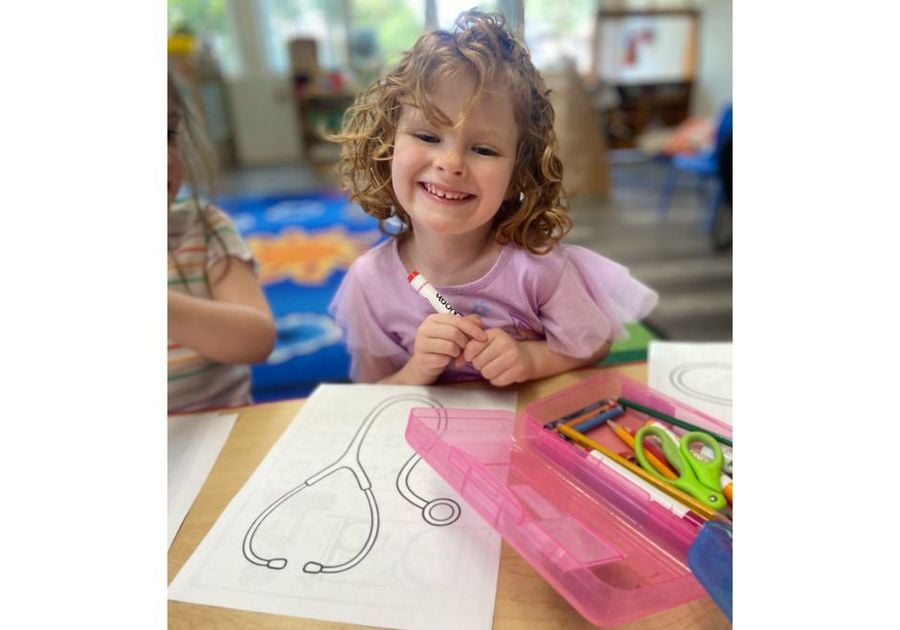 little girl coloring a stethescope