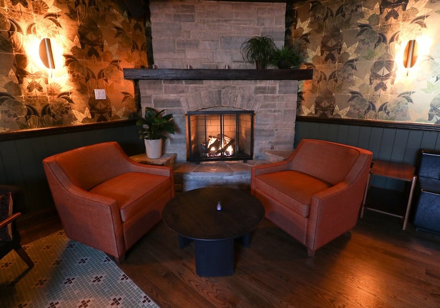 two armchairs by a fire