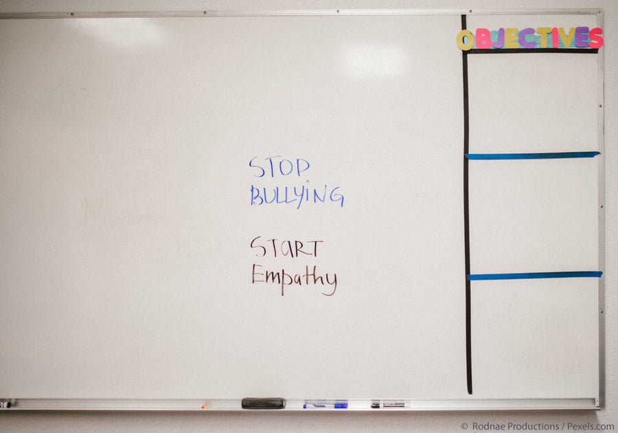 Stop Bullying, start empathy written on school white board