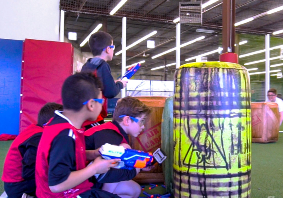 young boys playing nerf