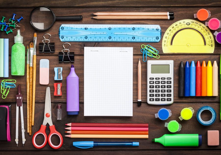 School supplies presented on blank wood