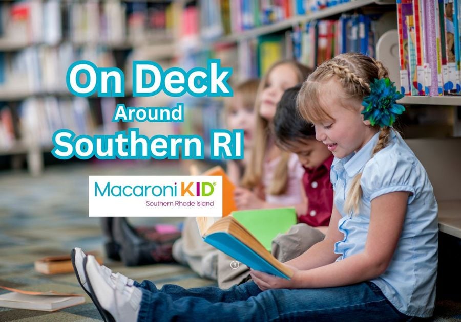 Children at library on floor reading books