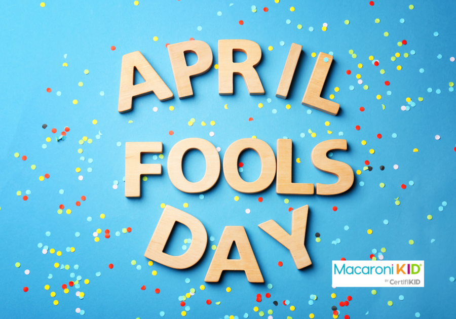 Word April Fools Day and Confetti on Blue Background