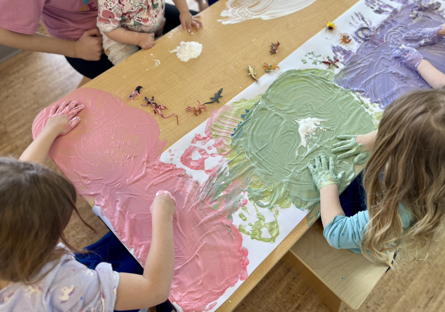 Kids Garden Children with hands in paint on table