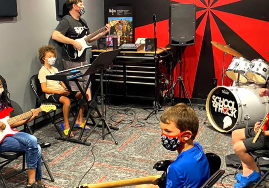 school of rock santa ana kids practicing in room