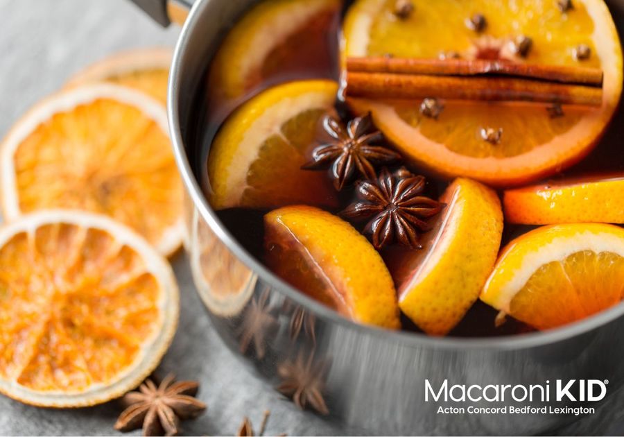 Oranges and cinnamon in a pot of water