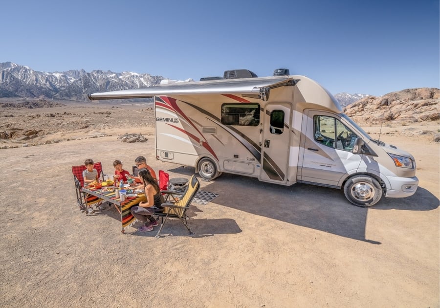 Family eating near their RV