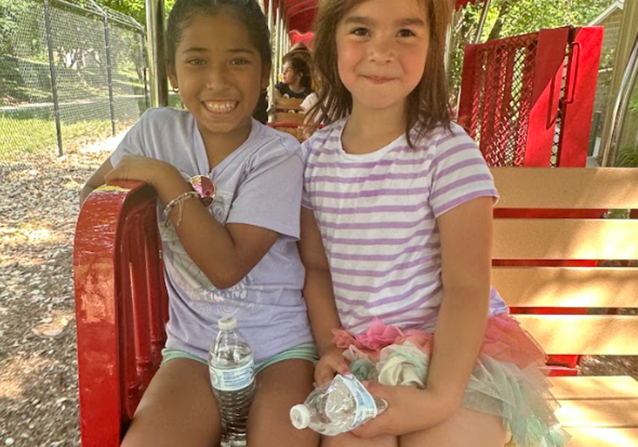 Kids smiling on a train