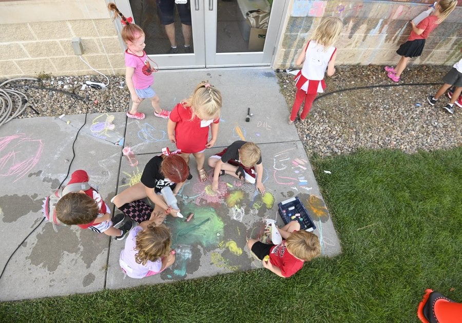 Kids coloring with chalk