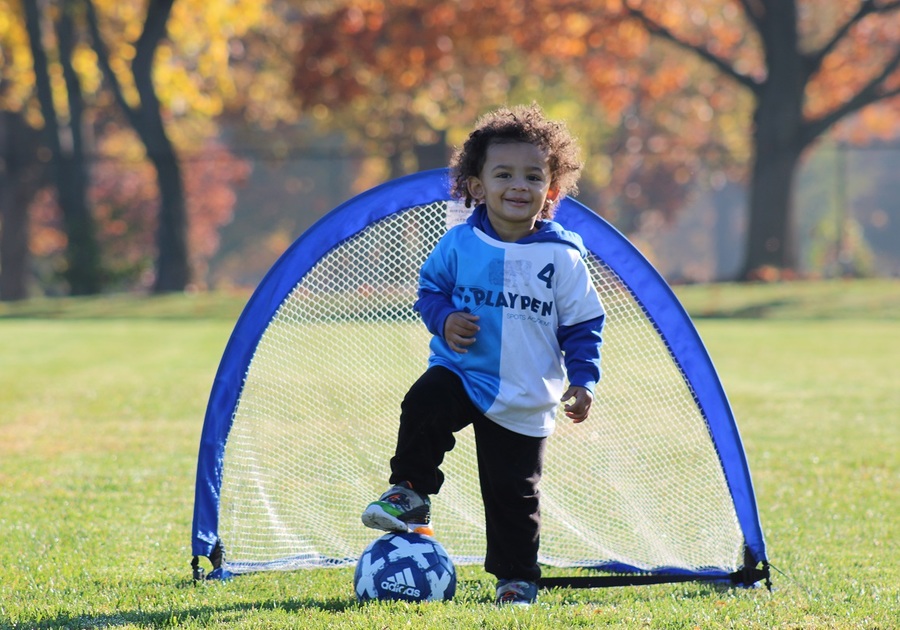 toddle playing soccer goalie