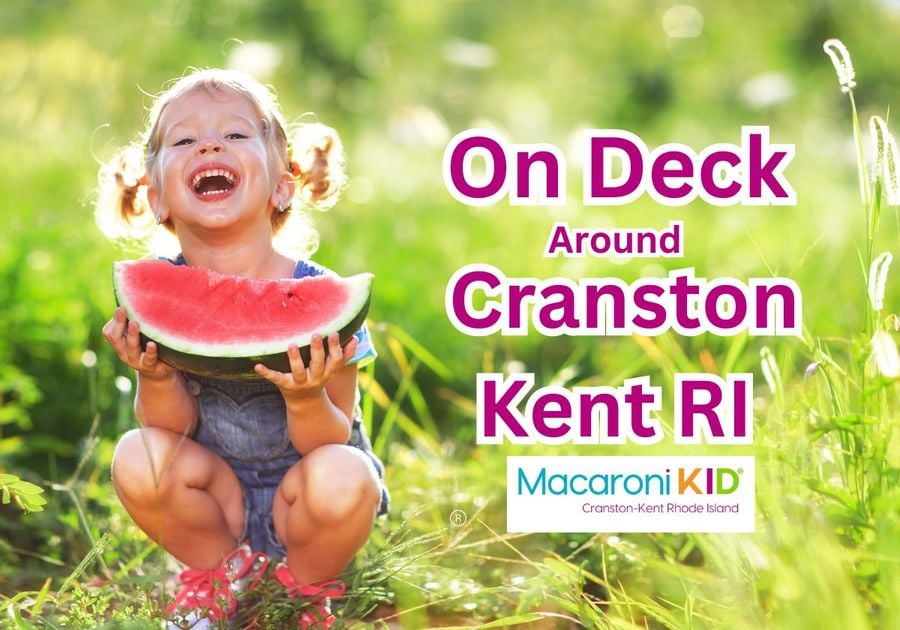 Child happy eating watermelon in field