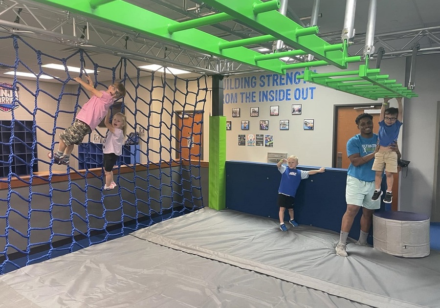 preschooler on monkey bars