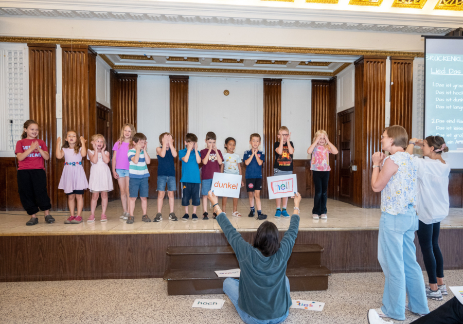 Kids on stage singing