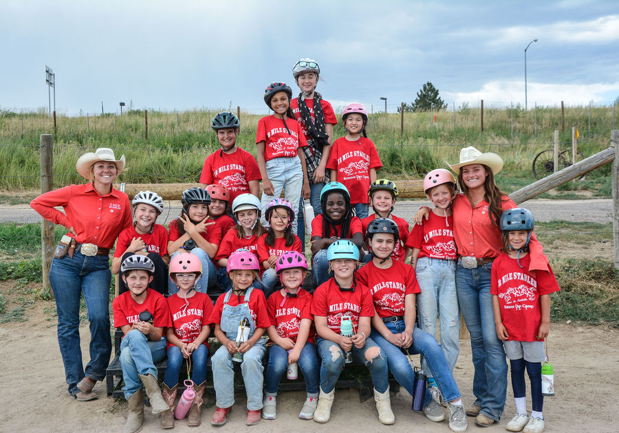 group photo with instructions and campers at Big Horn Stables horse camp