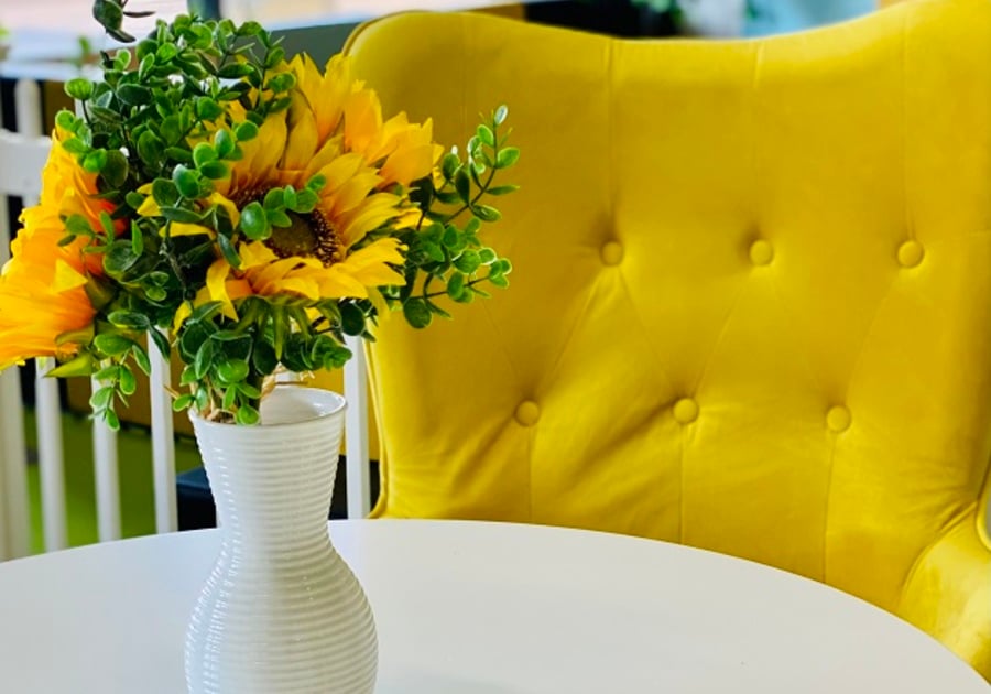 yellow chair with yellow flowers