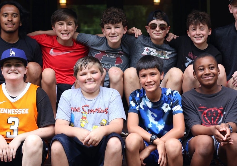 photo of group of young male campers posing for photo