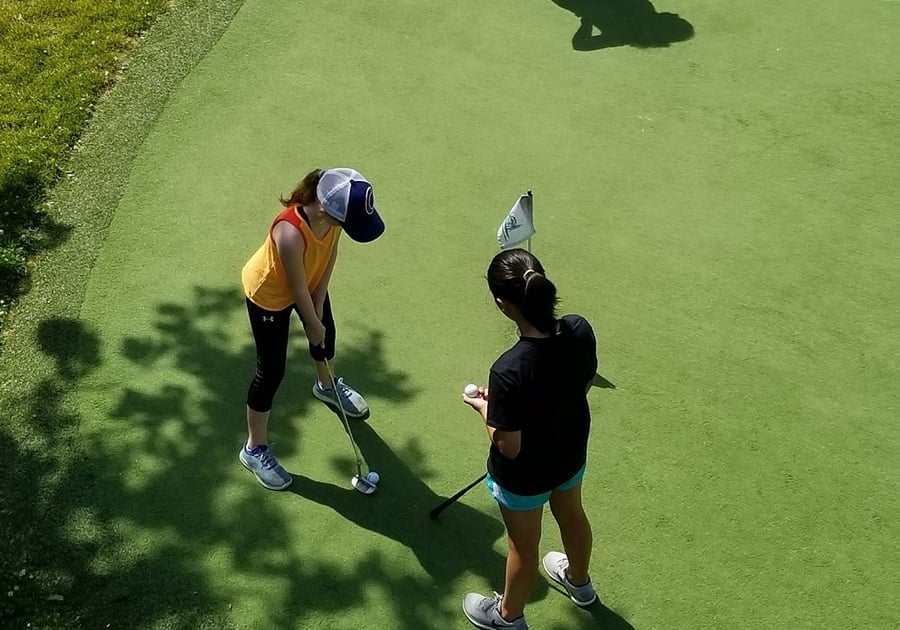 two teens girls putting