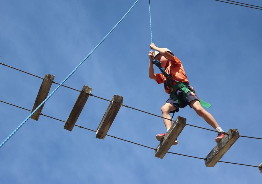 Child climbing on rope structure