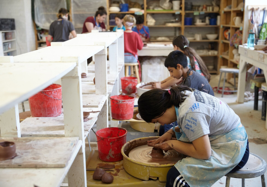 kids on pottery wheels