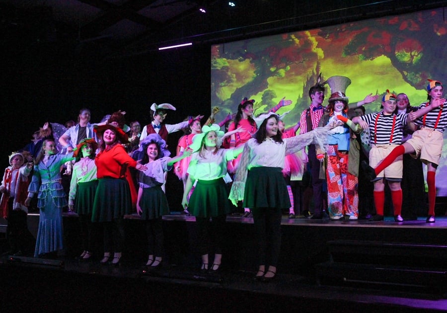 campers posing on stage