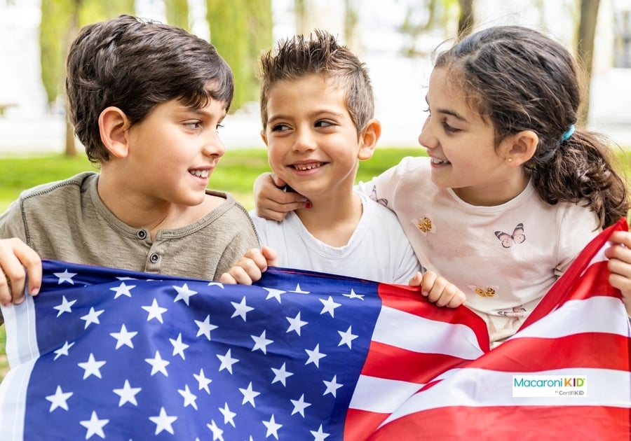 Three kids holding American flag