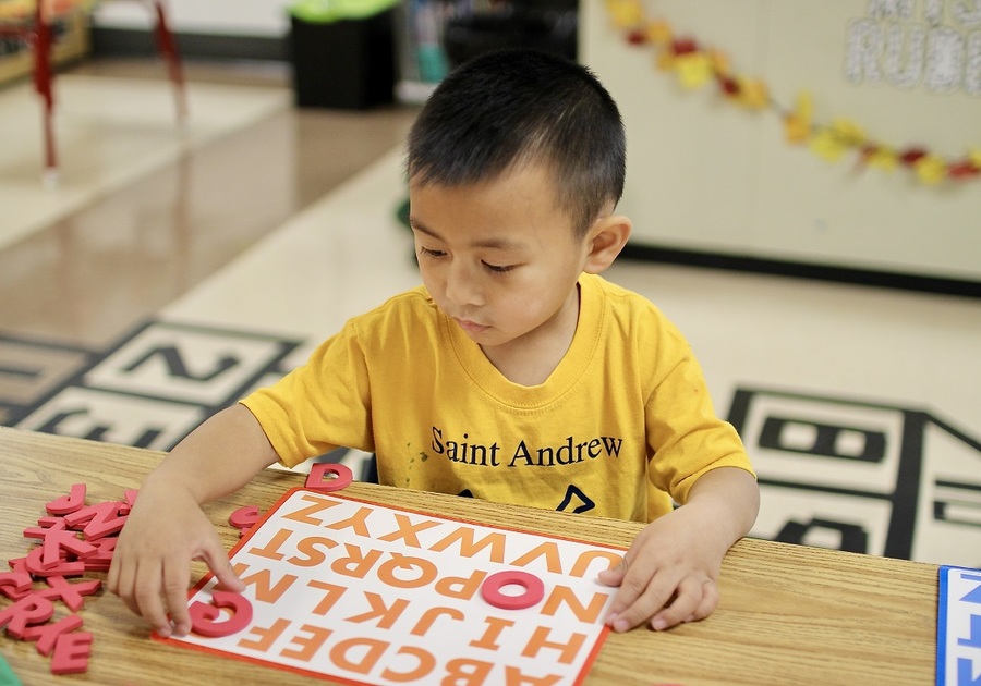 boy using letter chart