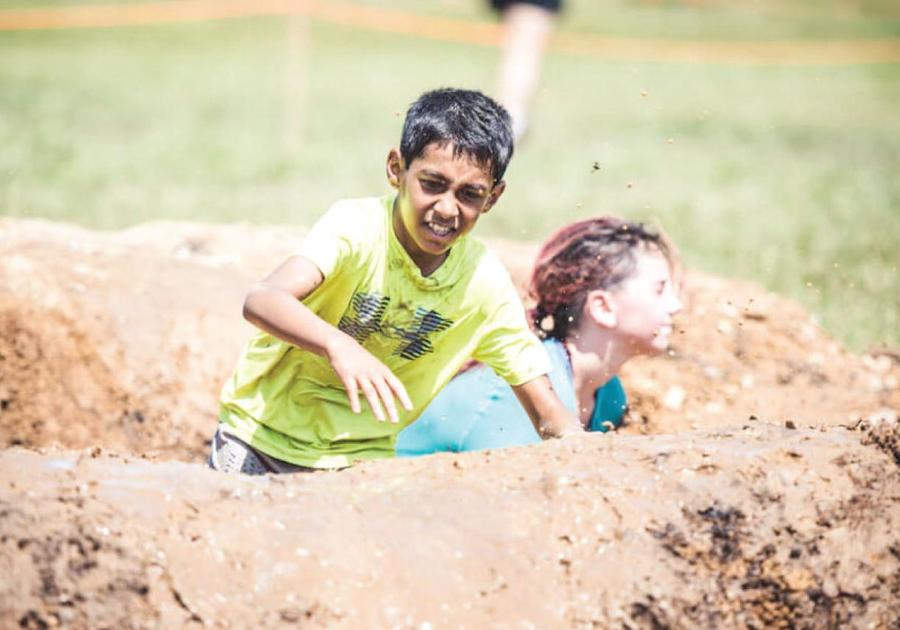 Tough Mud Kids going through mud puddle