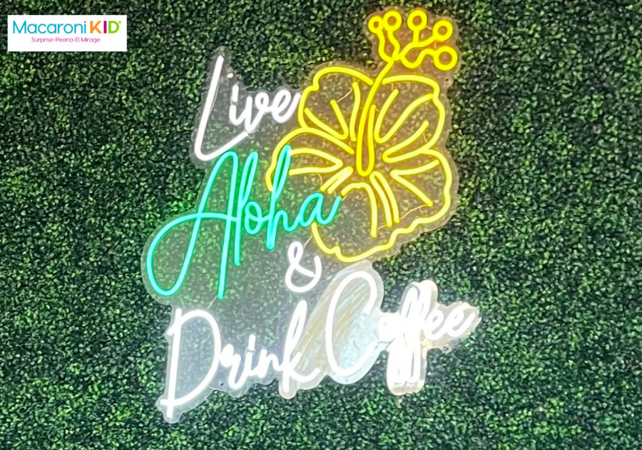 Neon sign on green wall that reads Live Aloha and Drink Coffee