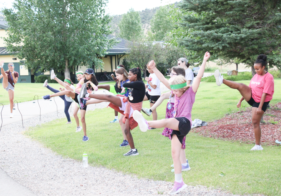 Campers doing high kicks at Roundup River Ranch