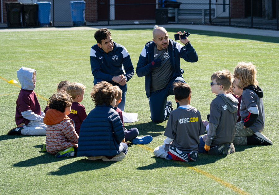 soccer coaches coaching kids