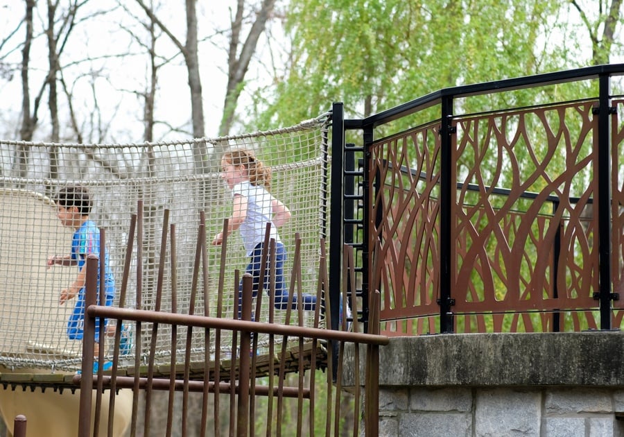 photo of children running across rope bridge