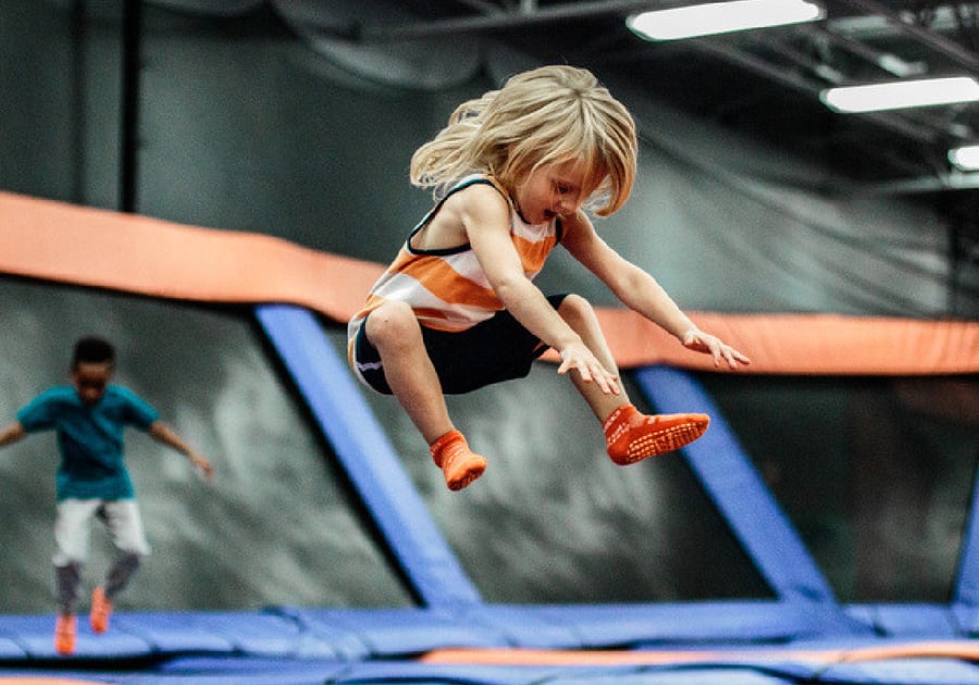 Young child jumping on a trampoline at Sky Zone Parker