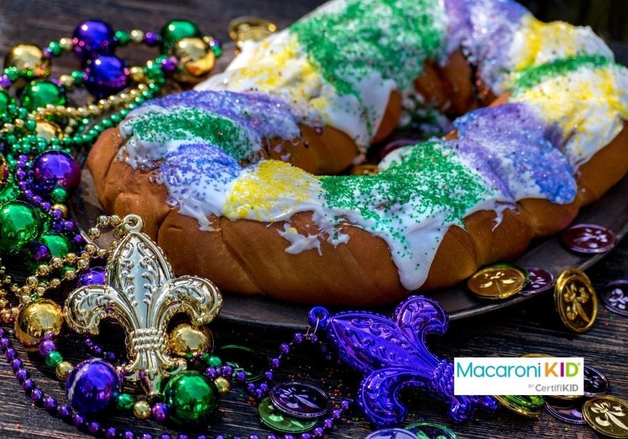 king cake surrounded by mardi gras decorations