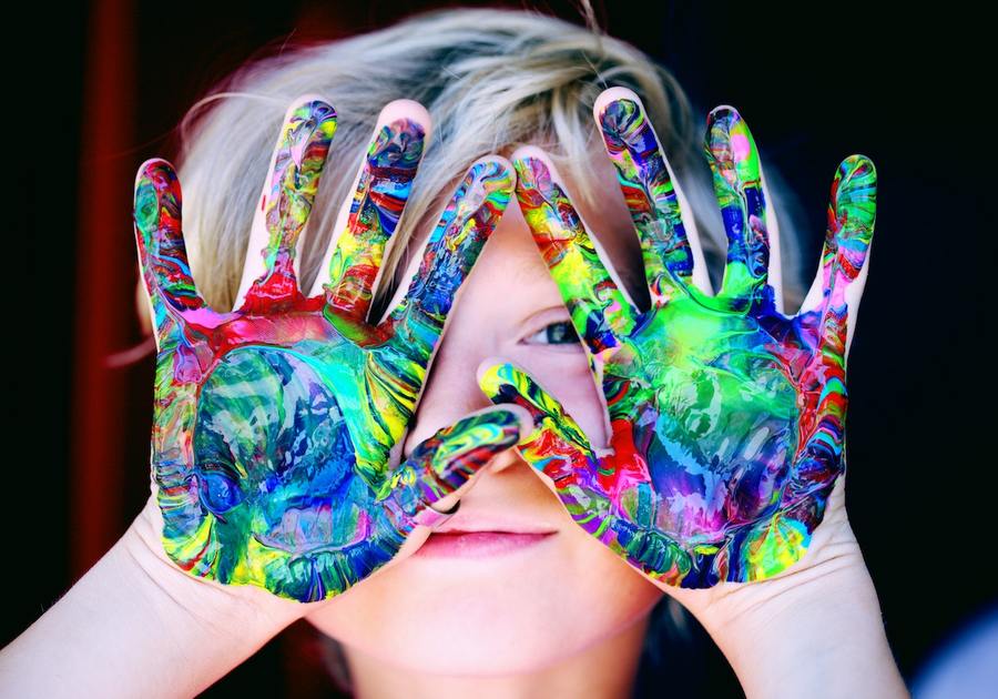 Little boy with painted hands