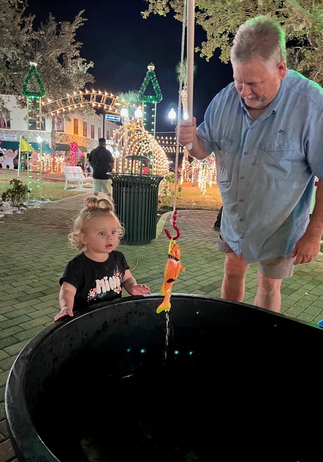 child playing in fish pond game