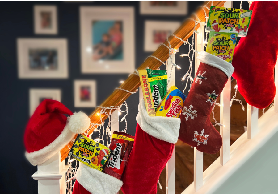 Stockings with Mondolez Candy hung on staircase