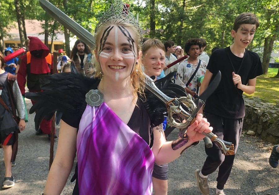 Teenagers in costumes playing outside