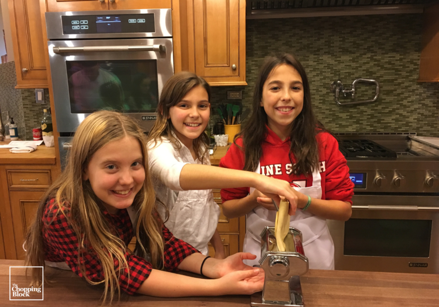 three girls making pasta together