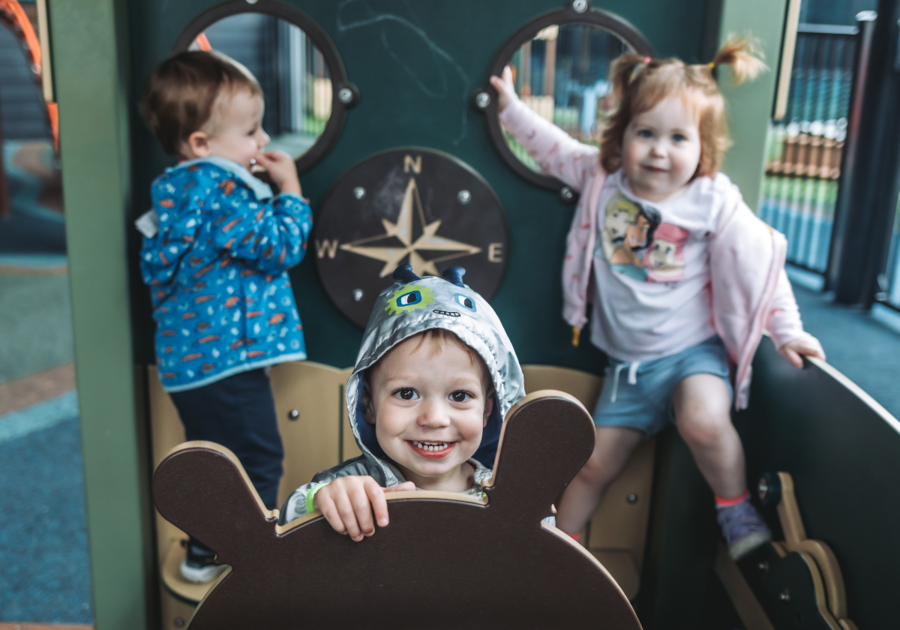 three toddlers on playground