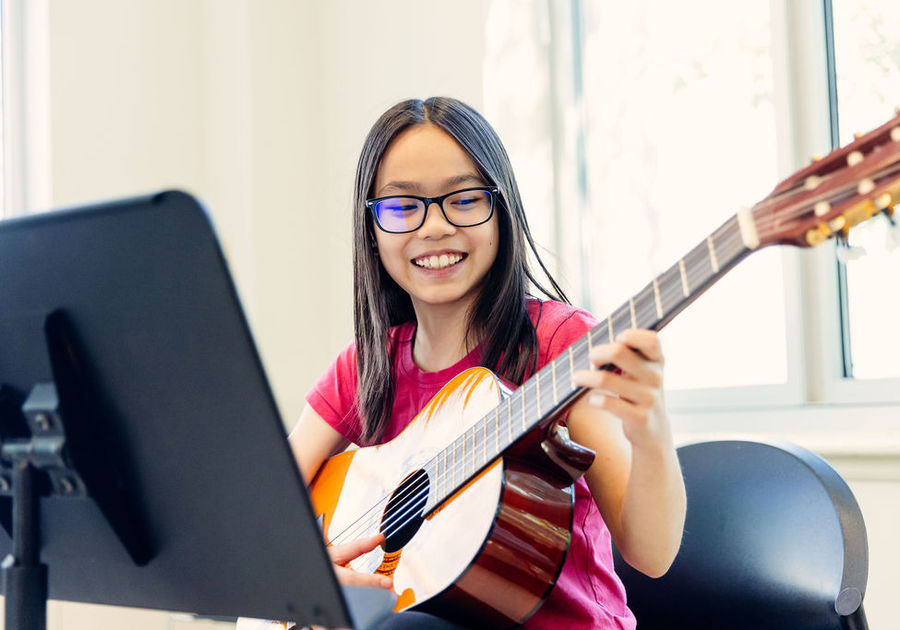 girl playing guitar