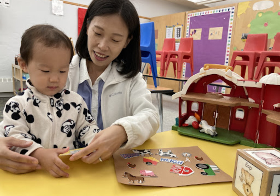 Teacher and child playing