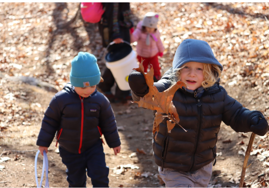 Children dressed in layers playing outside